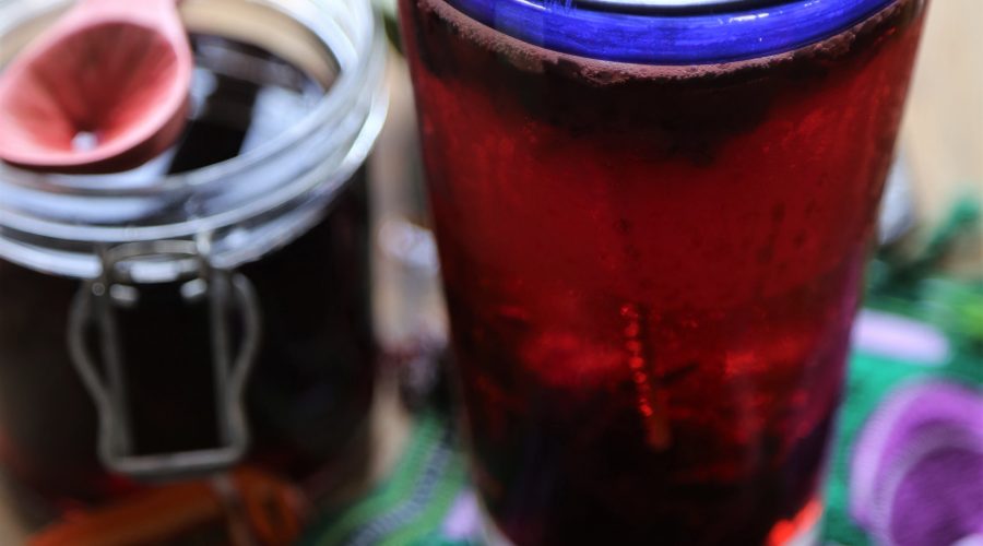 Hibiscus beer served alongside showcasing the syrup