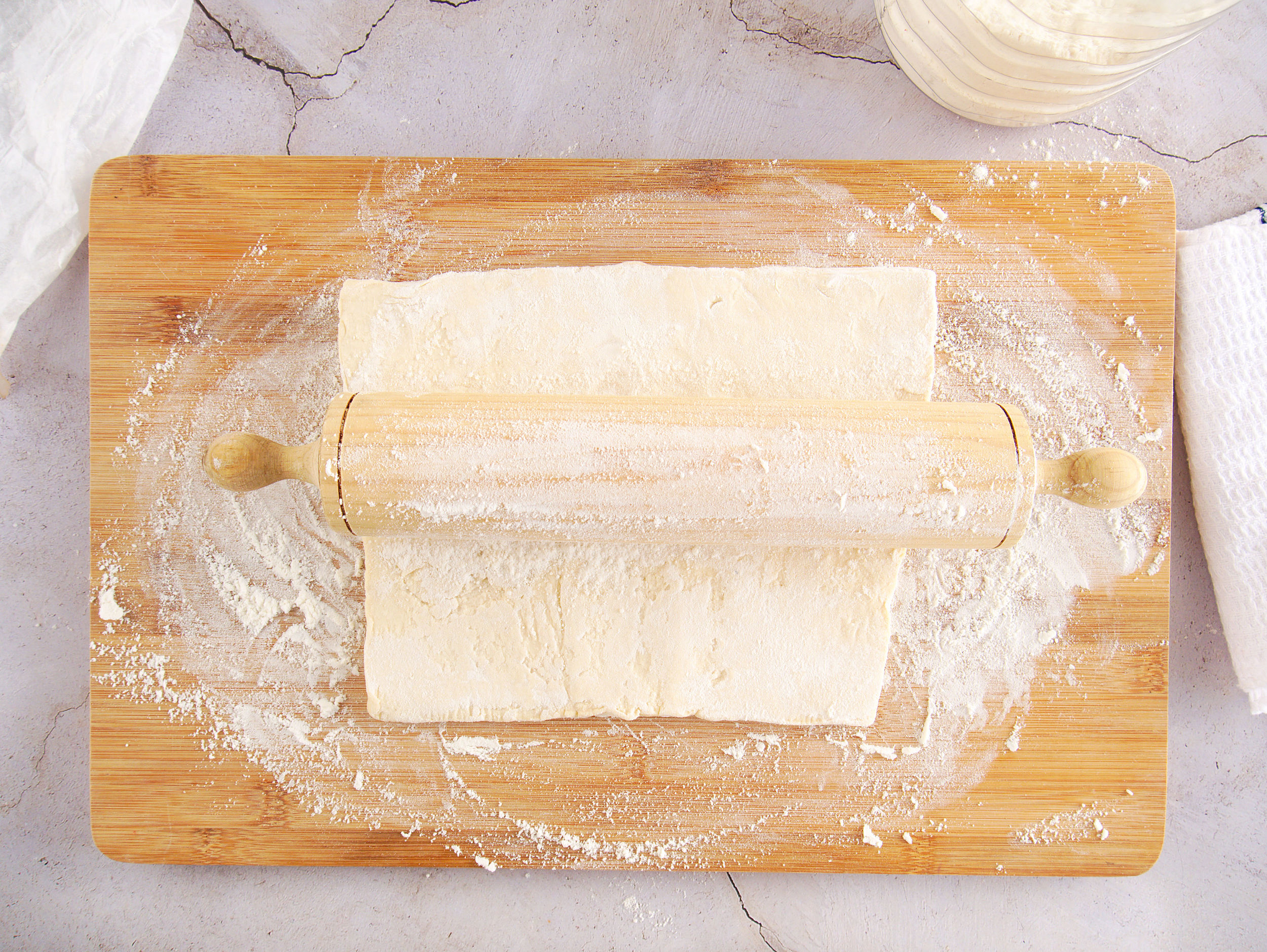 Dusting your cutting board with flour helps prevent the puff pastry from sticking