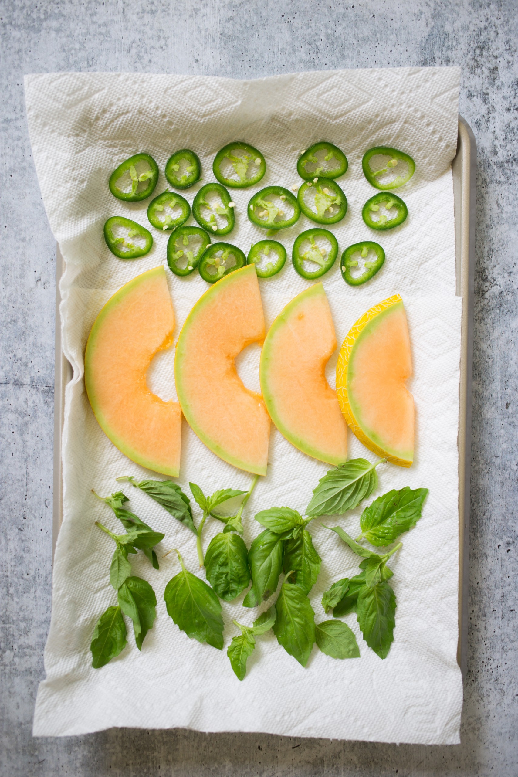Fresh Salsa ingredients melon, basil, sliced jalapenos 