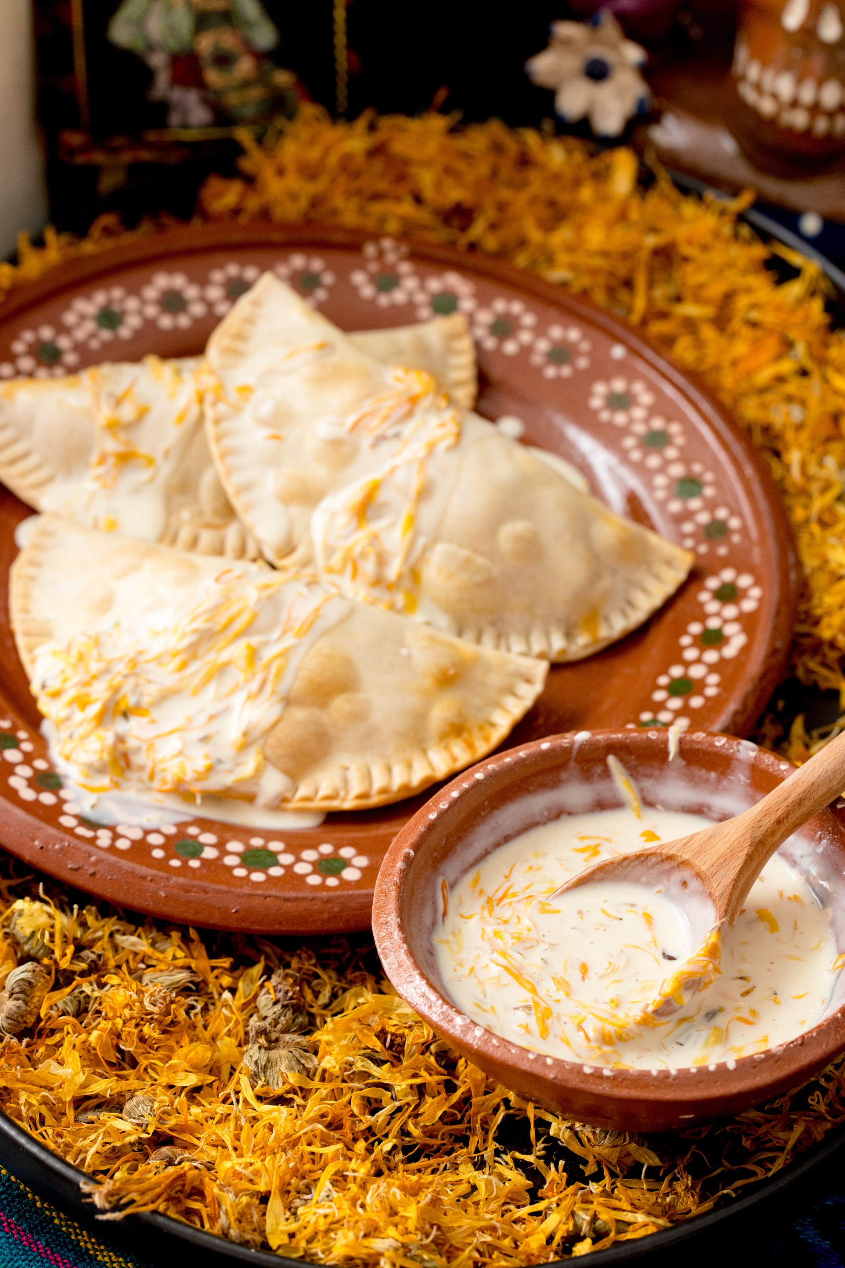 Guajillo Chicken Empanadas with Marigold Crema 
